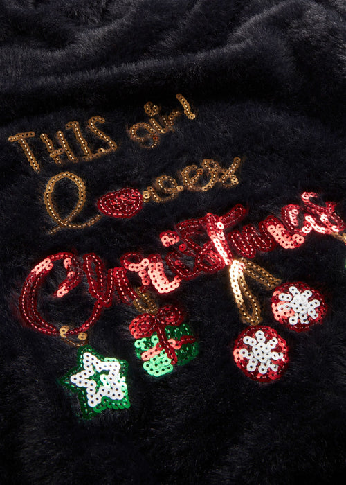 Pulover s otvorenim ramenima i božićnim motivom