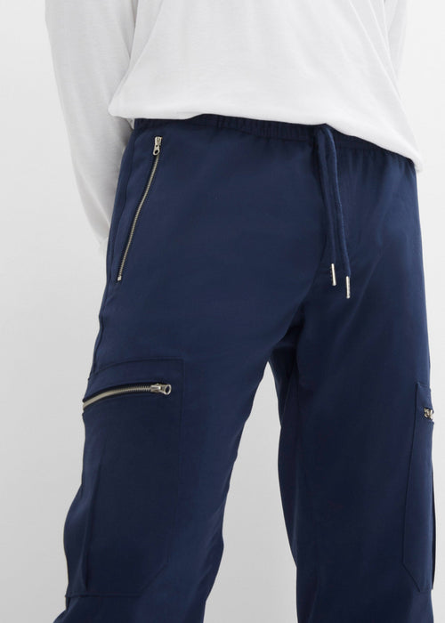 Klasične stretch hlače bez kopčanja s patentnim zatvaračima i uskim rubom