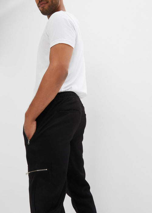 Klasične stretch hlače bez kopčanja s patentnim zatvaračima i uskim rubom